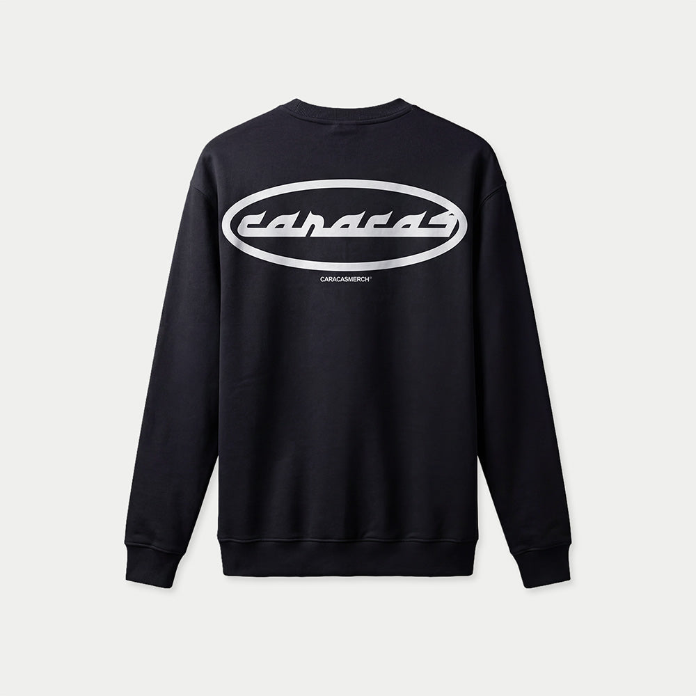 Sudadera oversized negra «Caracas» de Caracas Merch, vista trasera plana, con el óvalo blanco grande