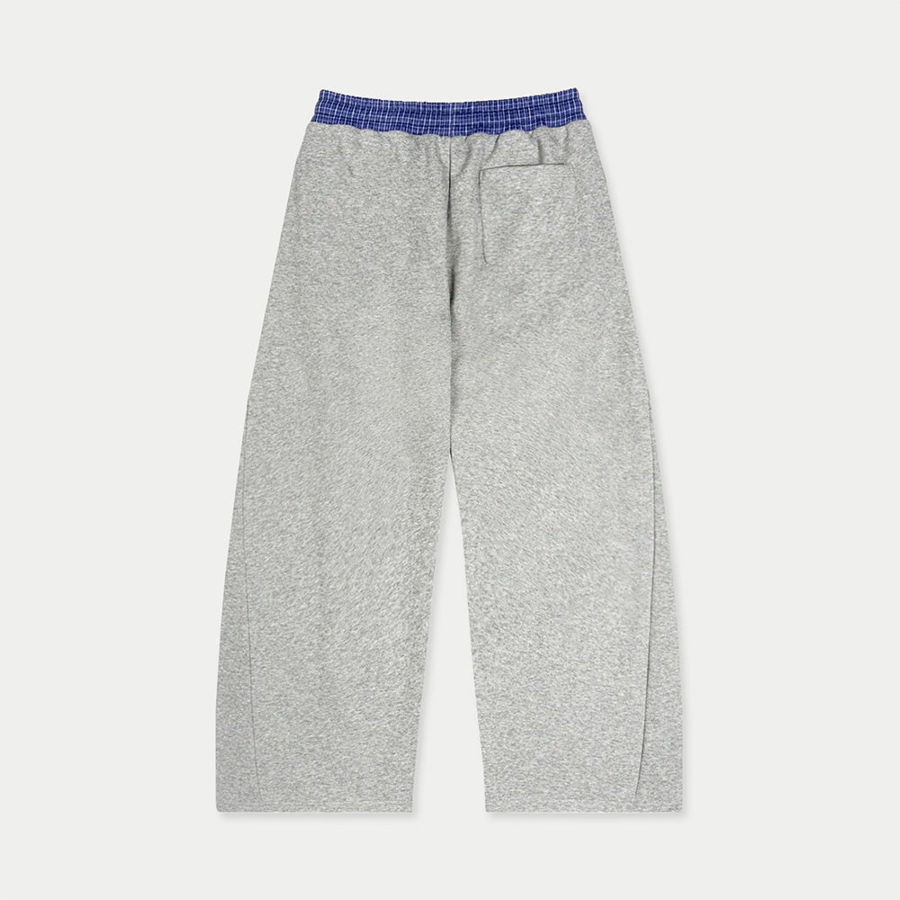 Back view of gray Caracas Merch sweatpants with elastic waistband