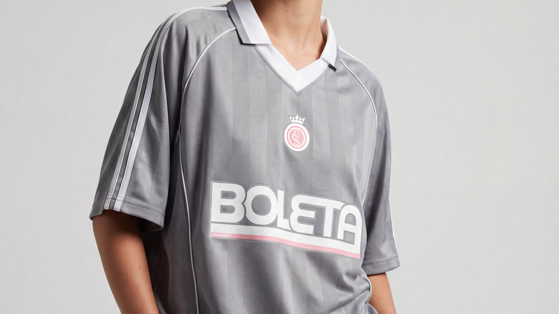 female model wearing gray boleta soccer jersey by caracas merch