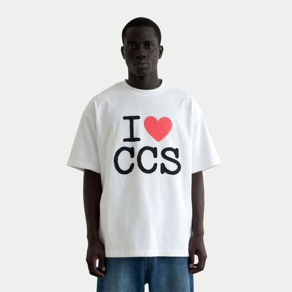Male model wearing i love caracas white graphic t-shirt by Caracas Merch