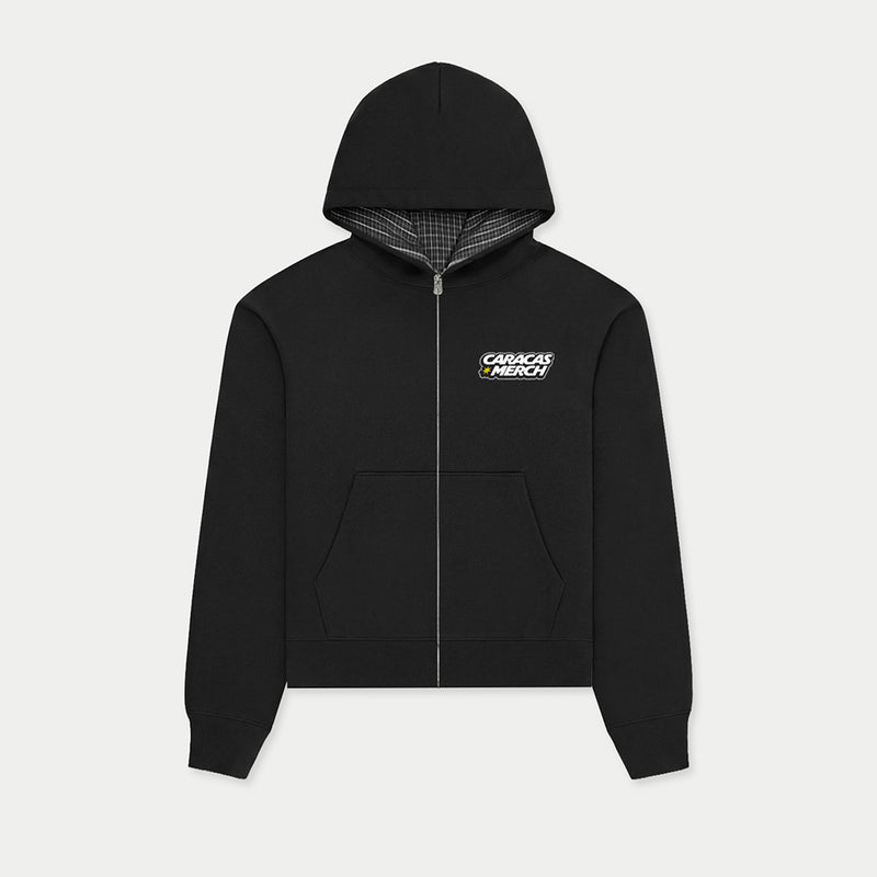 Black zip-up hoodie with plaid hood lining and Caracas Merch logo