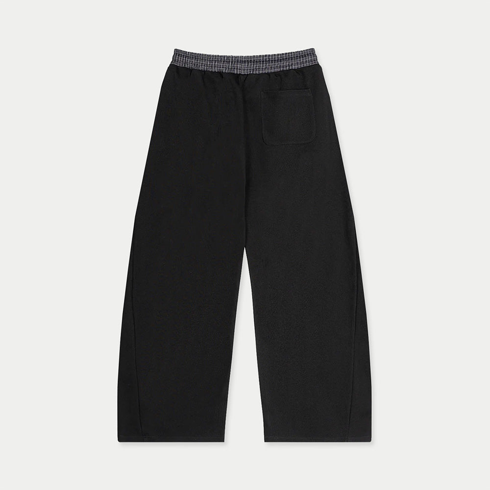 Back view of black tracksuit sweatpants with rear pocket by Caracas Merch