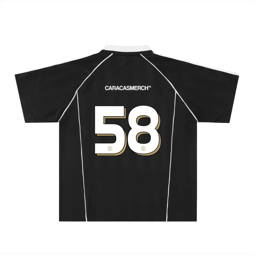 Black soccer-style jersey back view with “CARACASMERCH” text on upper back and large number 58 in white with gold outline – Caracas Merch