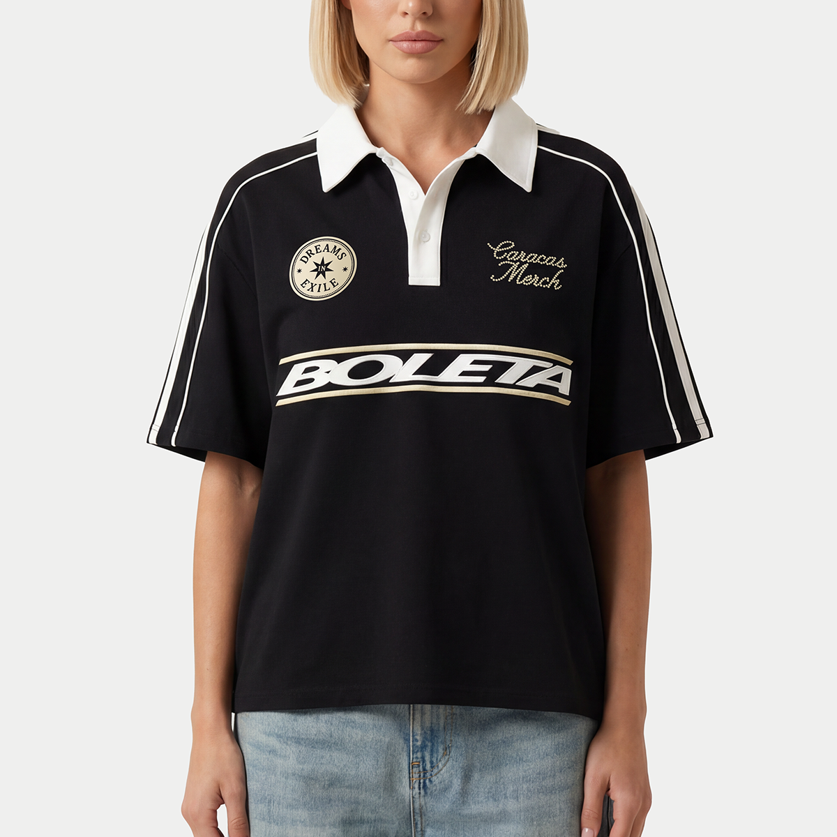 Model wearing black Boleta soccer polo jersey by Caracas Merch