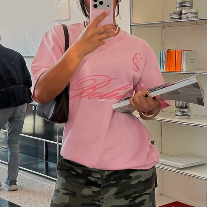Model wearing pink Boleta oversized graphic t-shirt in casual streetwear look