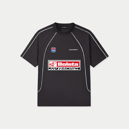 Black Boleta Racing jersey by Caracas Merch with “Boleta Racing” patch graphic at front, front view