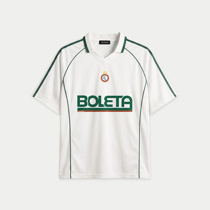White soccer-style jersey front view with striped texture, V-neck collar, and bold “BOLETA” graphic across the chest – Caracas Merch