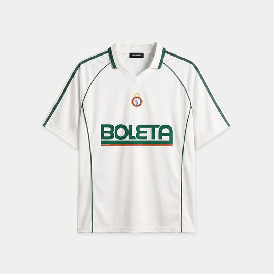 White soccer-style jersey front view with striped texture, V-neck collar, and bold “BOLETA” graphic across the chest – Caracas Merch