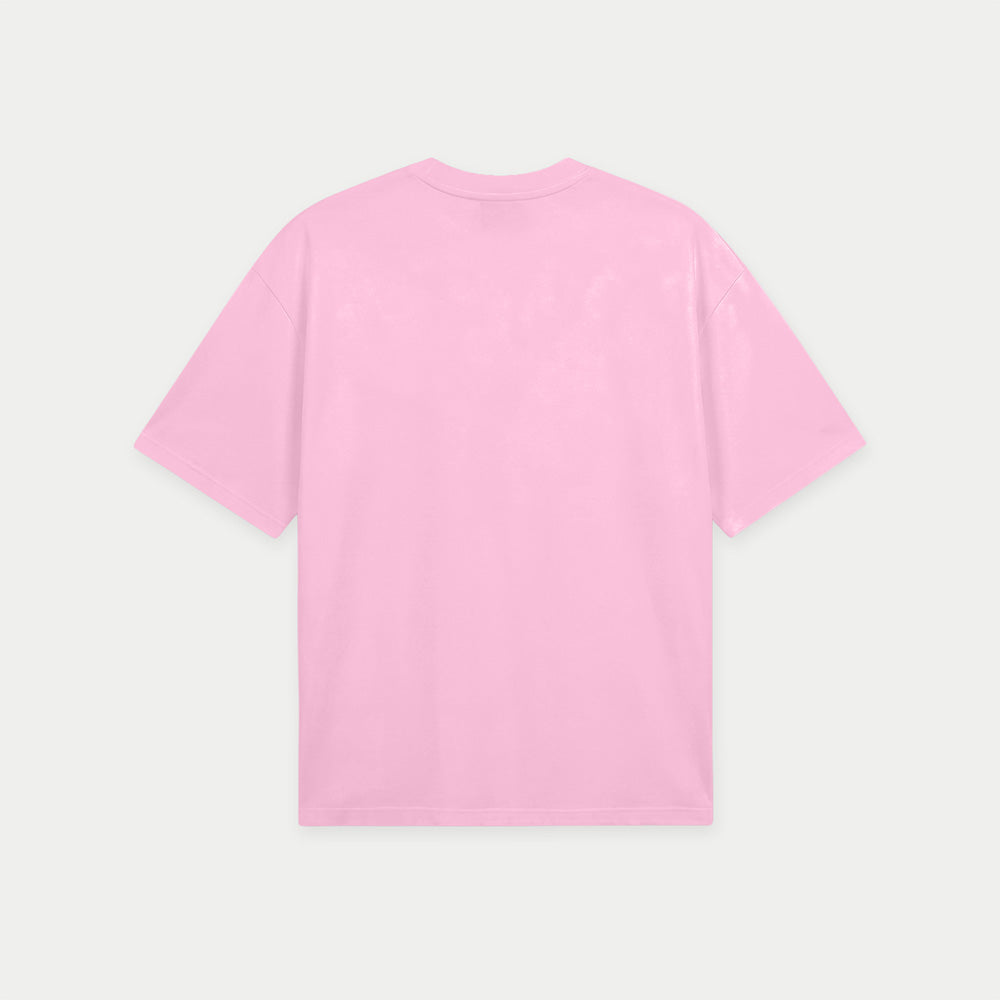 Pink oversized t-shirt back view with eraser graphic and “Bórralo que fue con lápiz” text in blue label style – Caracas Merch