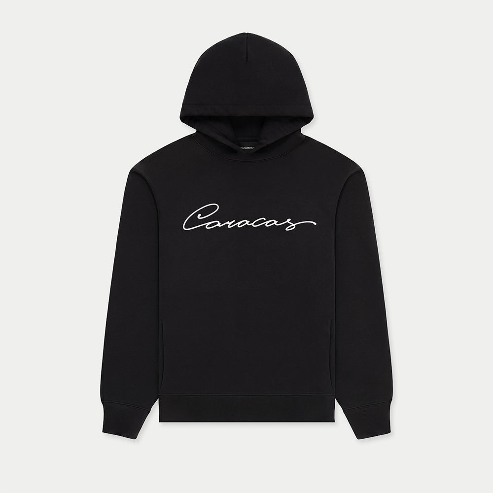 Black Caracas Merch hoodie with white script logo on front