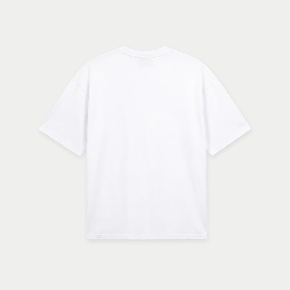 White oversized t-shirt back view with collage-style graphic featuring paint palette, brushes, and vintage classroom images with “Caracas” text – Caracas Merch