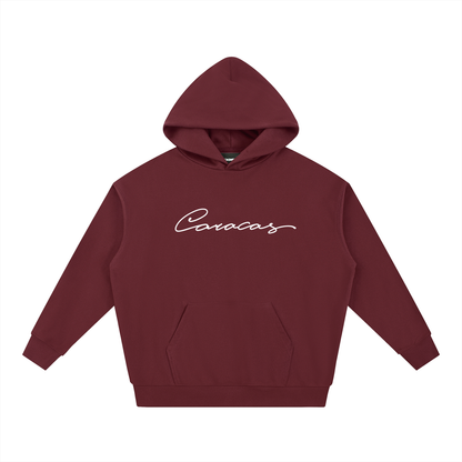 Caracas burgundy hoodie with script logo by Caracas Merch