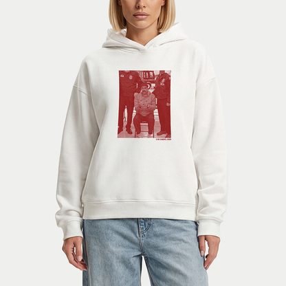 White hoodie featuring red-toned graphic artwork inspired by political imagery
