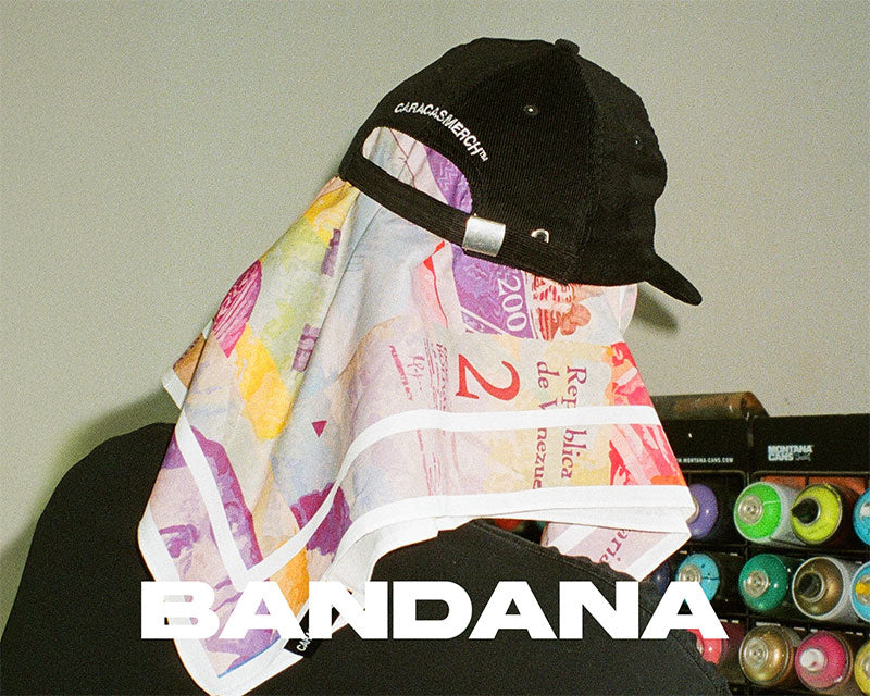 Lifestyle image of Caracas Merch bandana styled with cap