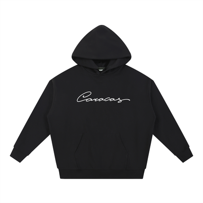 Black Caracas Merch hoodie with white script logo on front