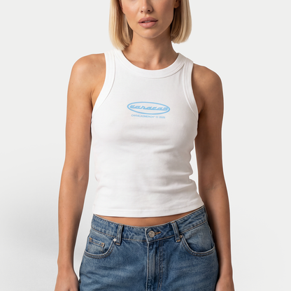 Female model wearing white tank top with blue Caracas logo by Caracas Merch