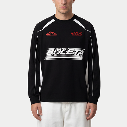 Model wearing black Boleta racing long sleeve by Caracas Merch