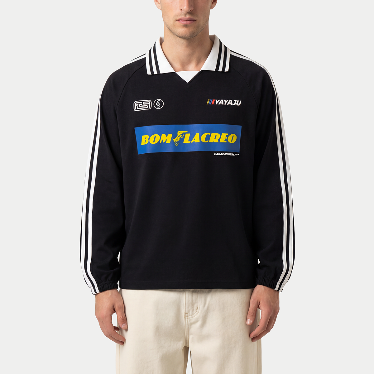 Male model wearing black Caracas Merch Bom Lacreo jersey front view