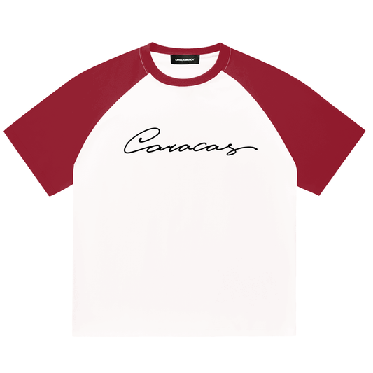 White and burgundy raglan t-shirt with black Caracas script logo