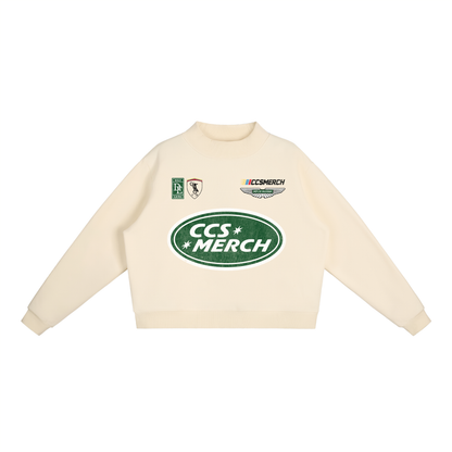 Front view of cream Caracas Merch crewneck with green CCS Merch logo print