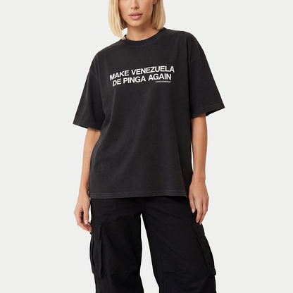 Female model wearing black “Make Venezuela De Pinga Again” t-shirt by Caracas Merch