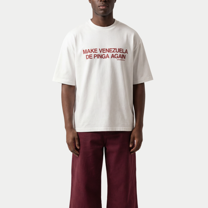 Male model wearing white “Make Venezuela De Pinga Again” t-shirt by Caracas Merch