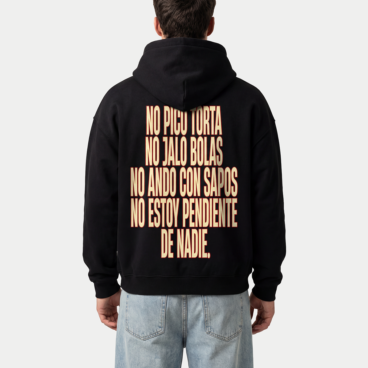 Model wearing black hoodie with “No pico torta no jalo bolas” print on back