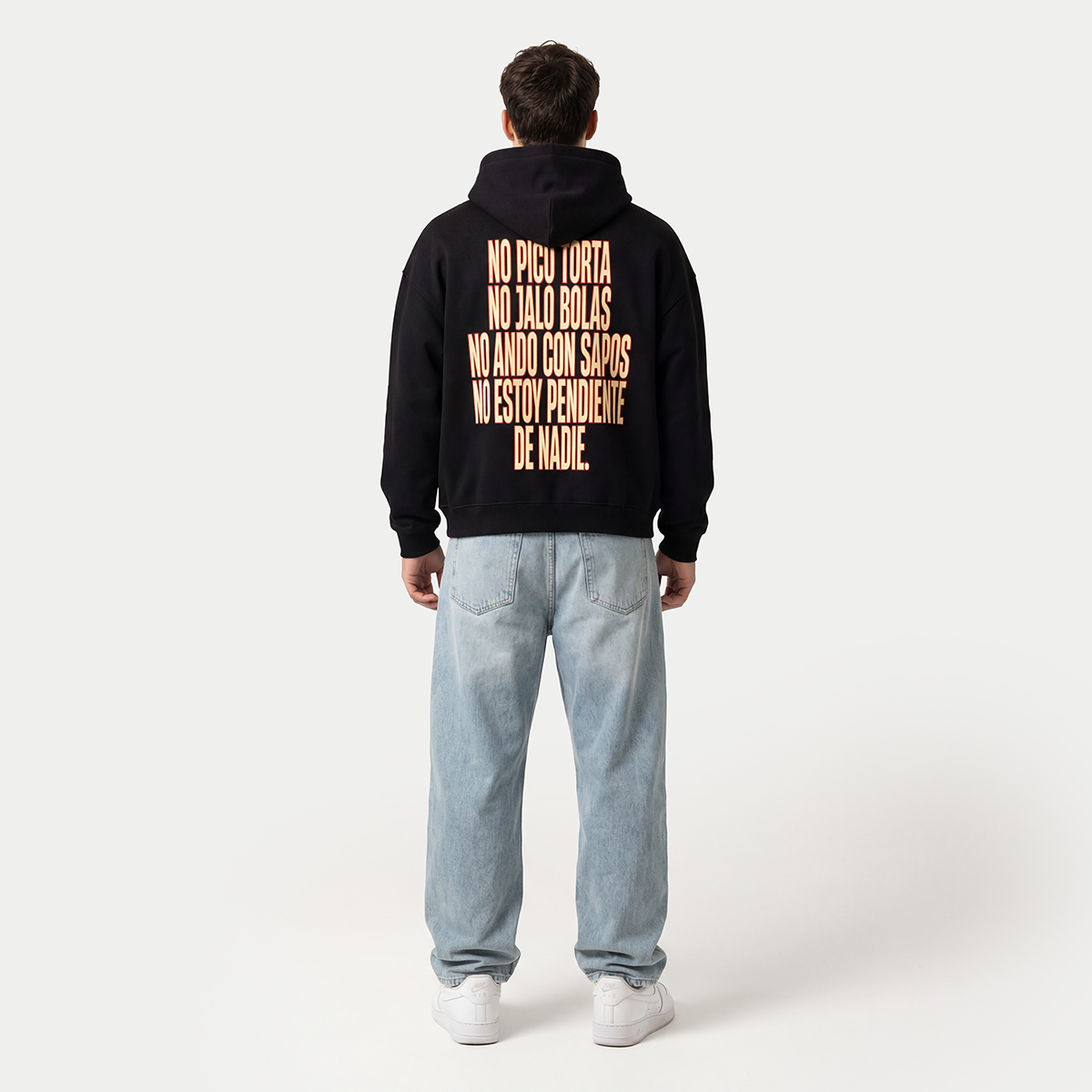 Full body back view of model wearing black hoodie with “No pico torta” print