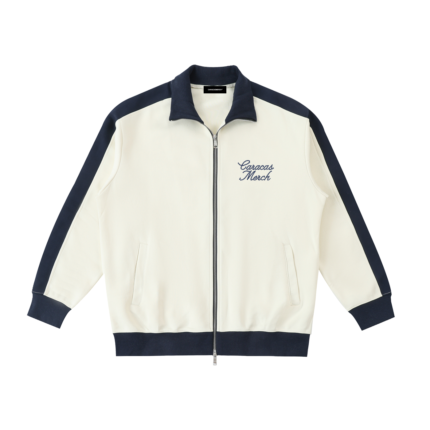 Front view of cream Caracas Merch zip jacket with navy details