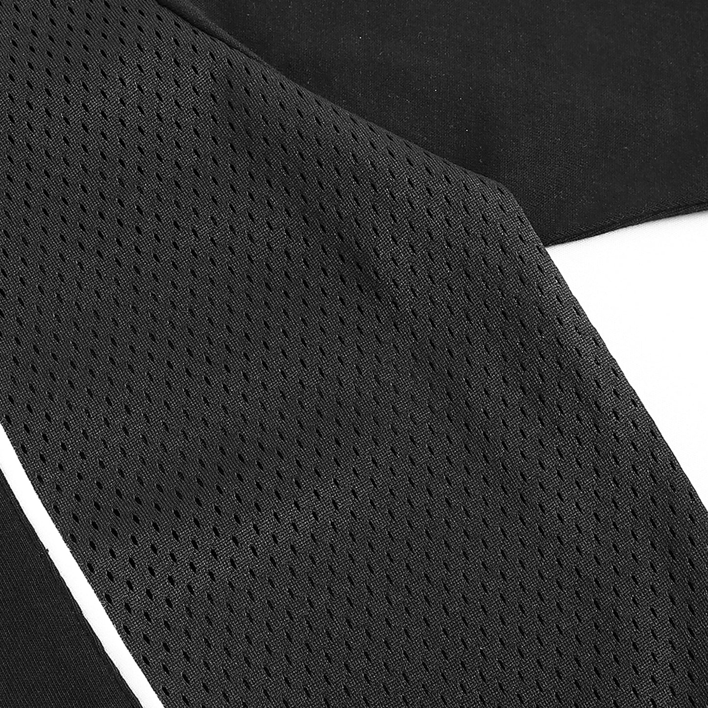 Close up of black mesh fabric detail on Caracas Merch performance t-shirt