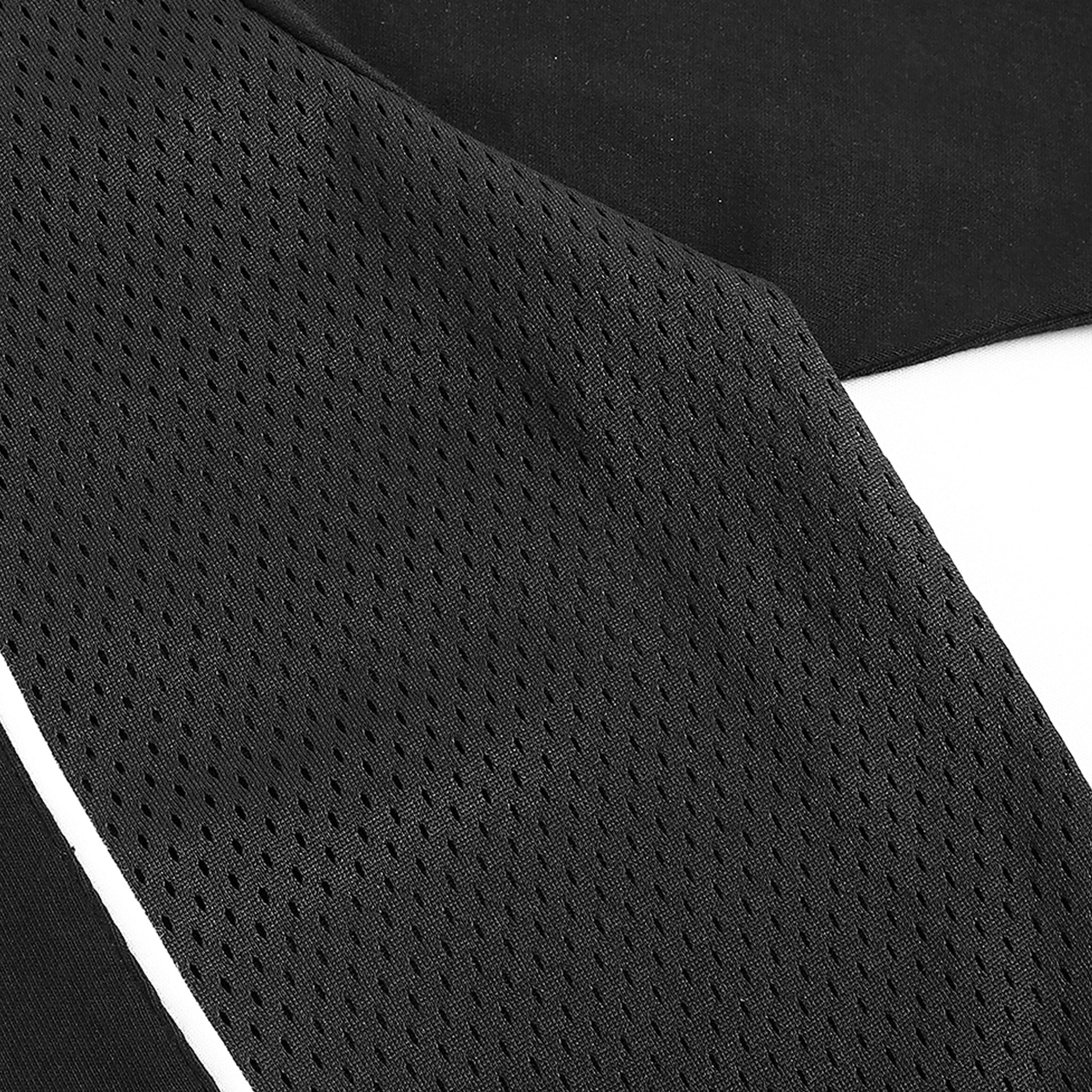 Close up of black mesh fabric detail on Caracas Merch performance t-shirt