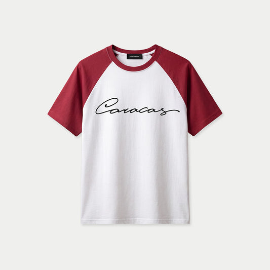White and burgundy raglan t-shirt with black Caracas script logo