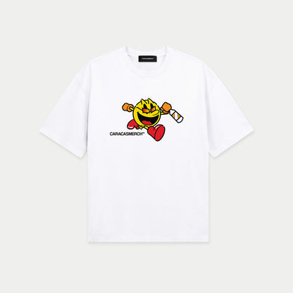 White oversized t-shirt front view with cartoon running character graphic holding a bottle and Caracas Merch logo underneath