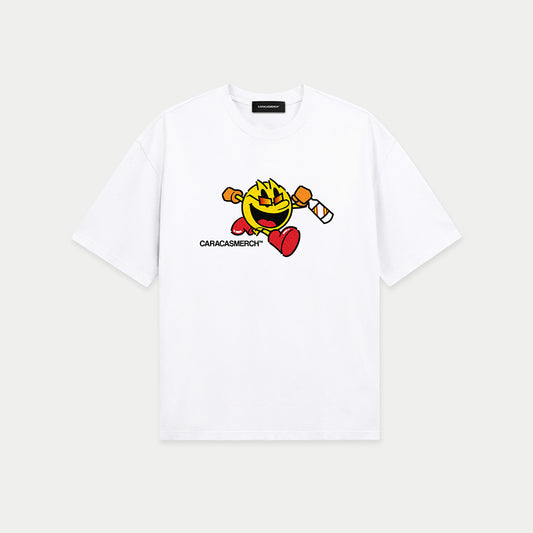 White oversized t-shirt front view with cartoon running character graphic holding a bottle and Caracas Merch logo underneath