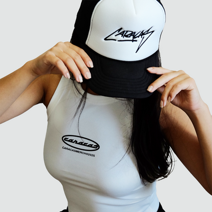 Model wearing white Caracas graphic tank top