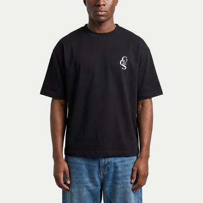 Model wearing black CCS t-shirt by Caracas Merch