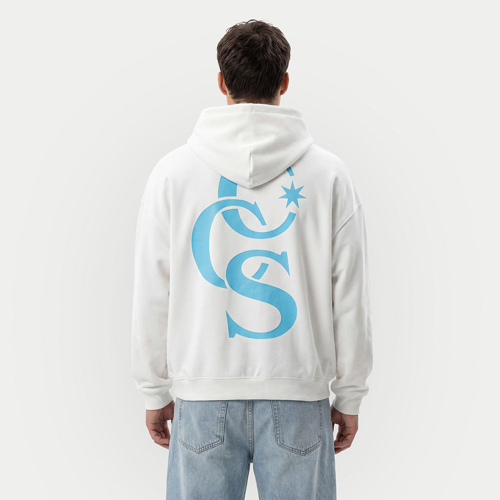 model wearing CCS Monogram Hoodie white with blue back print Caracas Merch streetwear hoodie