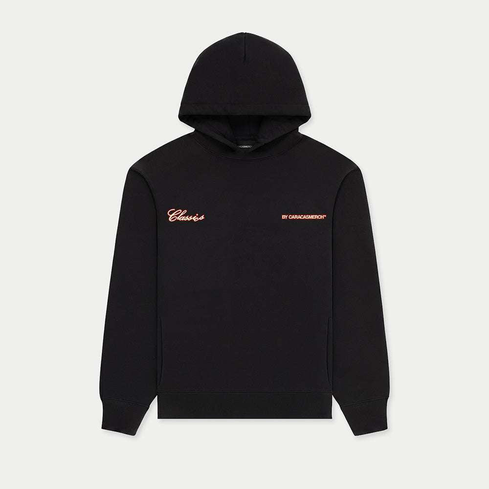 Front view of black Caracas Merch hoodie with small chest logo