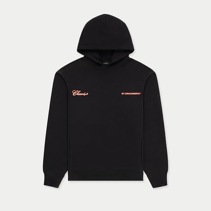 Front view of black Caracas Merch hoodie with small chest logo
