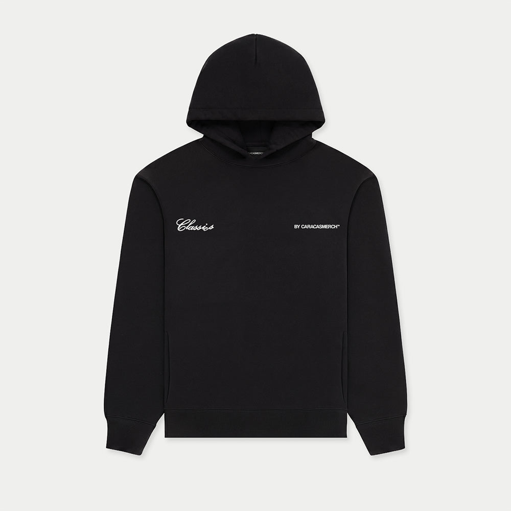 Black hoodie with Venezuelan phrase “No pico torta no jalo bolas” printed on back front view