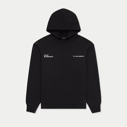 Black hoodie with Venezuelan phrase “No pico torta no jalo bolas” printed on back front view