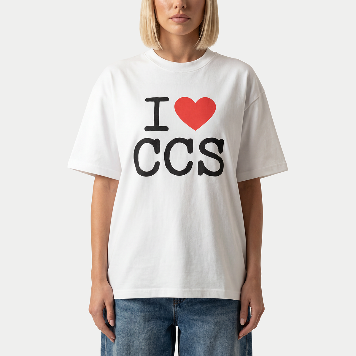 Close up of model wearing i love caracas white graphic t-shirt by Caracas Merch