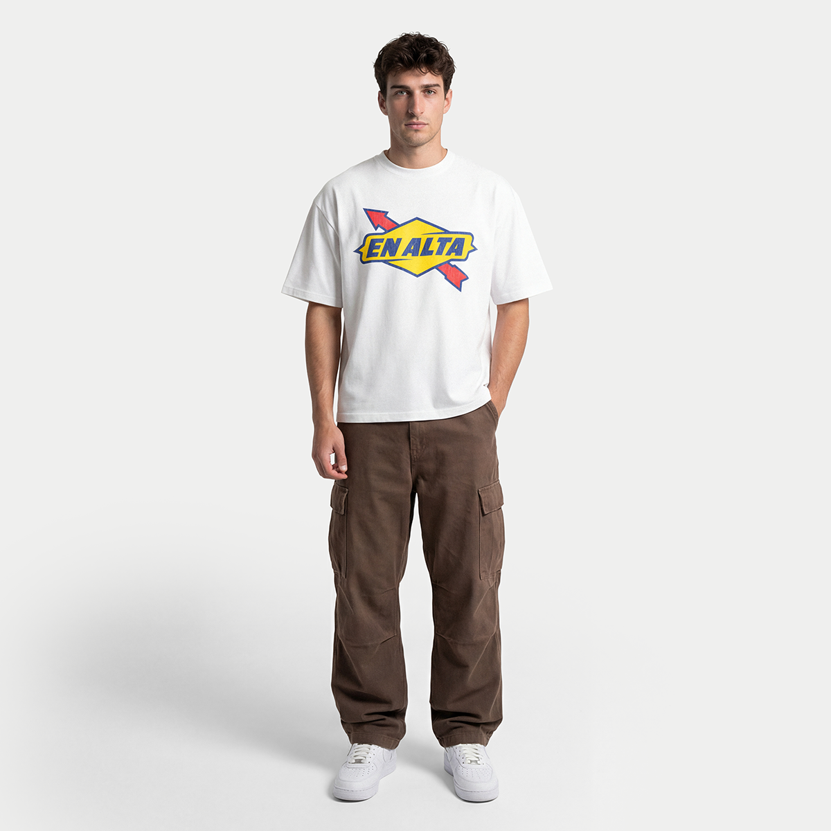 Full body view of model wearing En Alta white men’s t-shirt