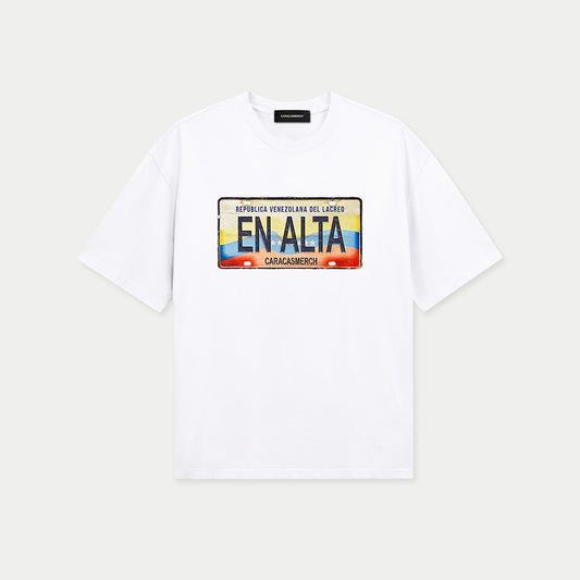 White t-shirt by Caracas Merch featuring En Alta placa de carro graphic inspired by Venezuela