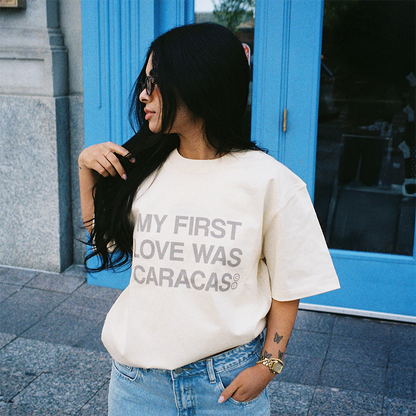 Female model wearing my first love was caracas graphic t-shirt