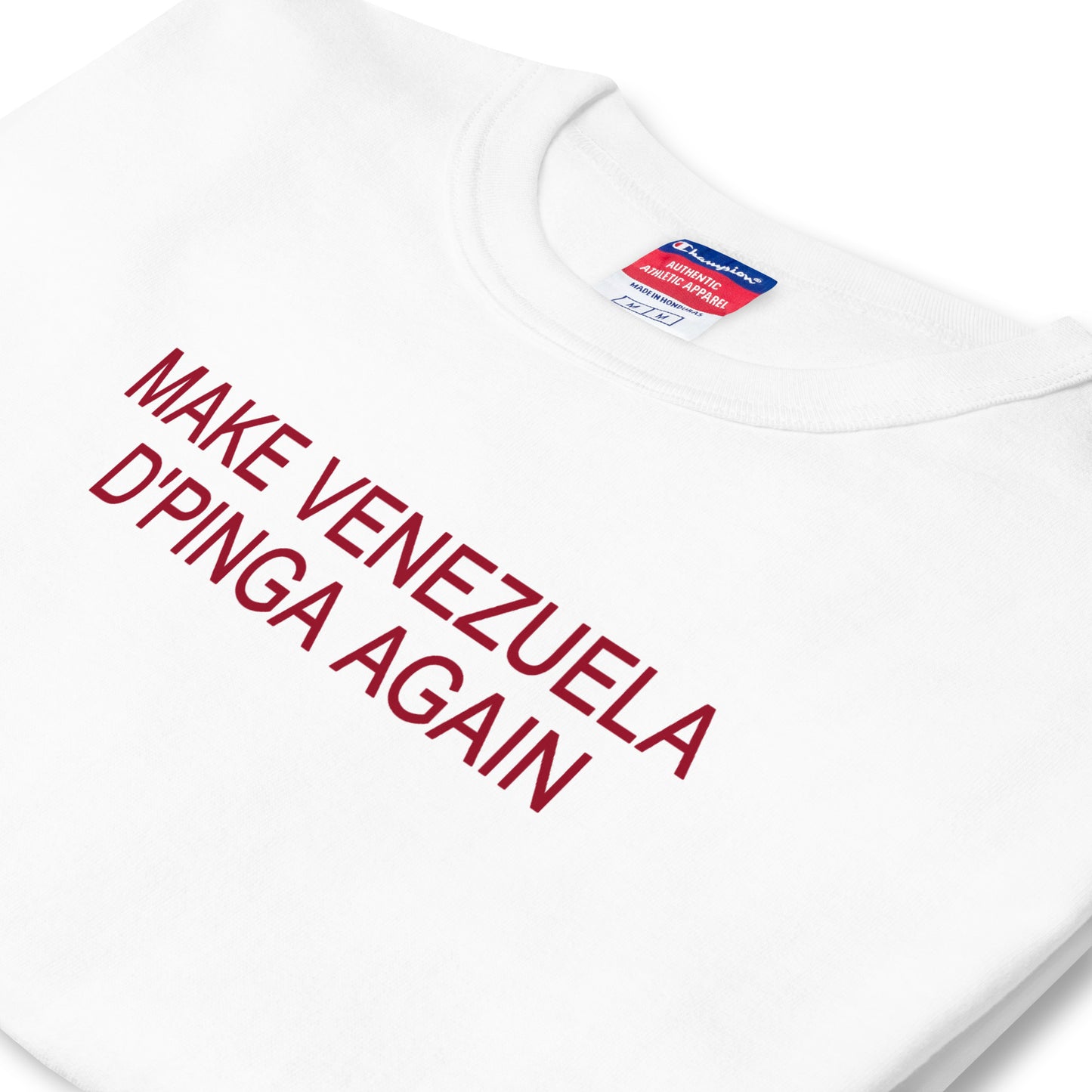 Camiseta blanca Make Venezuela De Pinga Again Champion de algodón, corte amplio, costuras reforzadas, y el logo “C” de Champion. Diseño inspirado en el deseo de una mejor Venezuela.