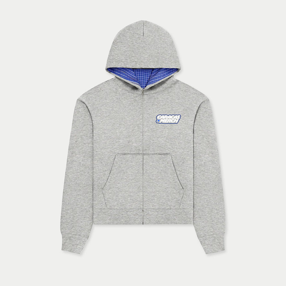 Front view of gray zip-up hoodie by Caracas Merch with blue inner hood lining and DTF logo
