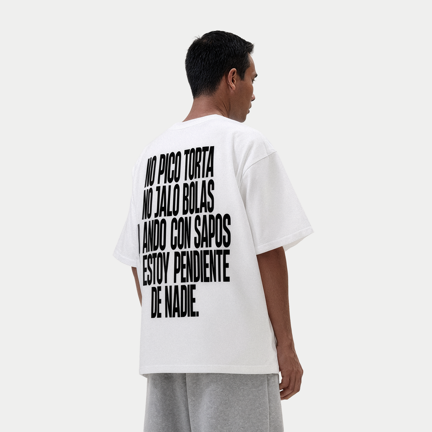 Male model wearing no pico torta no jalo bolas white graphic t-shirt