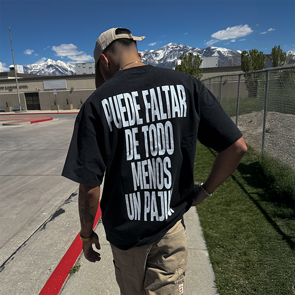 male model wearing puede faltar de todo menos un pajuo black tee lifestyle shot