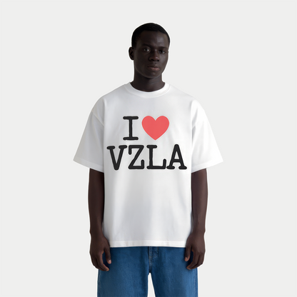 Male model wearing i love venezuela white graphic t-shirt by Caracas Merch